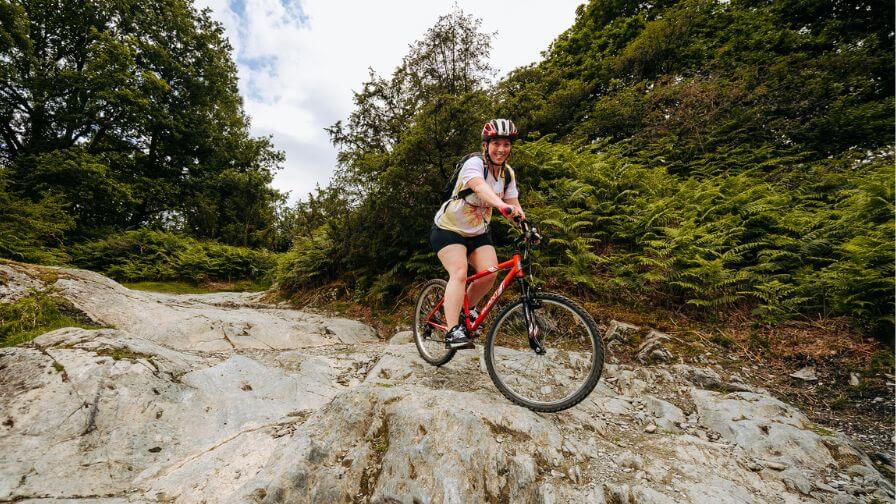 A single rider descending down a rocky terrain